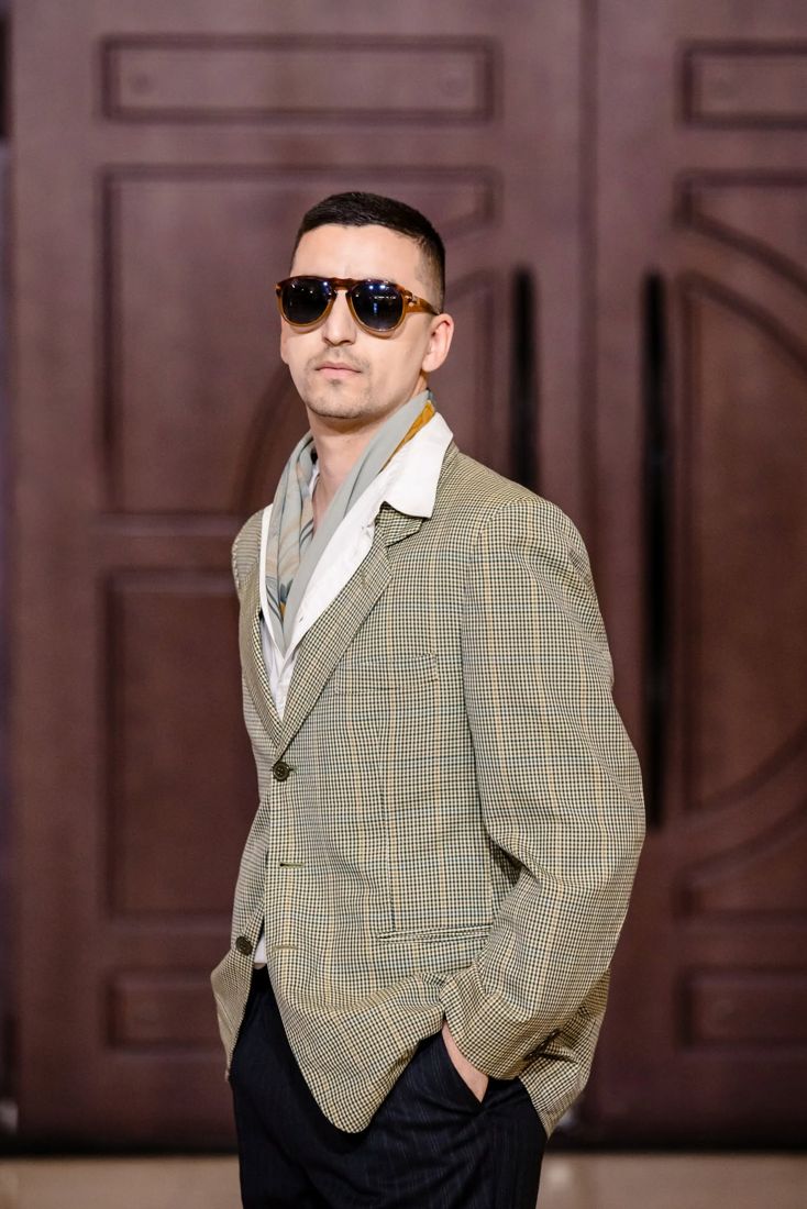 Look 02: Houndstooth check blazer over a white shirt, silk scarf, tortoise aviators