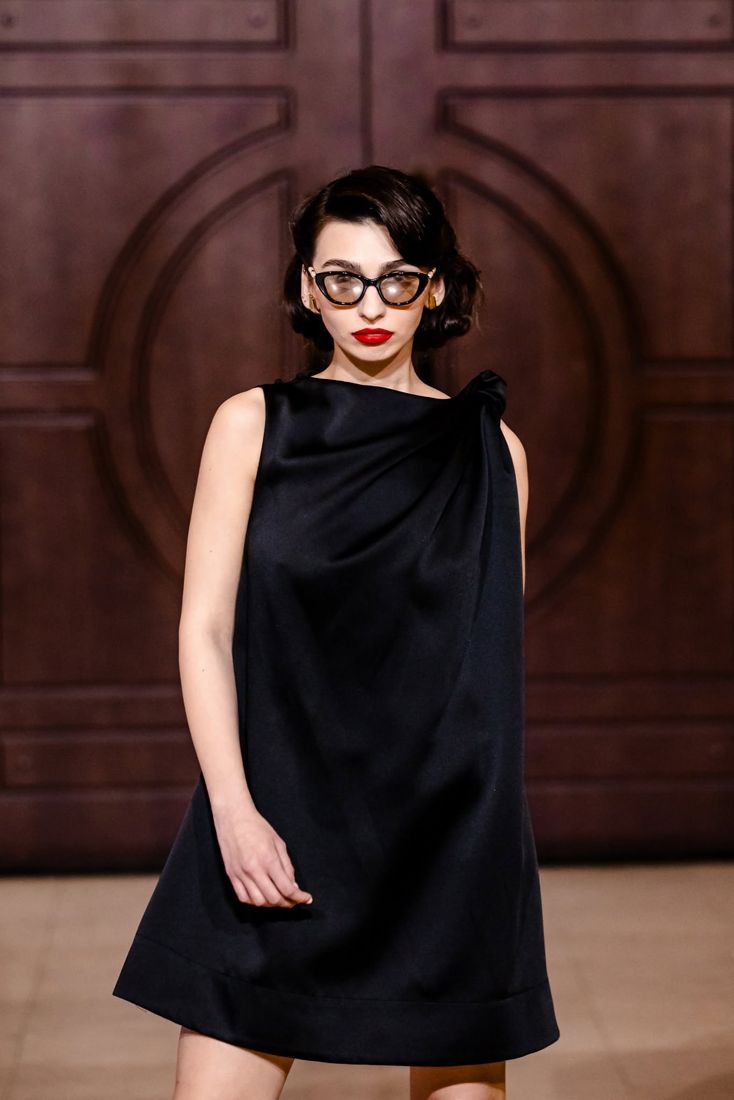 Look 04: Draped black satin shift, cat-eye glasses, red lip