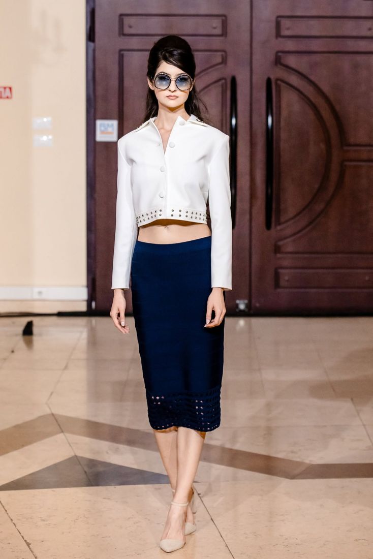 Look 09: Cropped studded white jacket, navy knit pencil skirt
