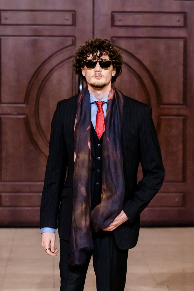 Look 15: Pinstripe suit, red tie, long silk scarf