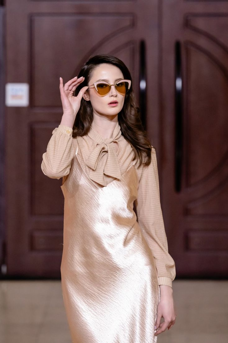 Look 27: Champagne satin slip over a bow blouse, cat-eye shades
