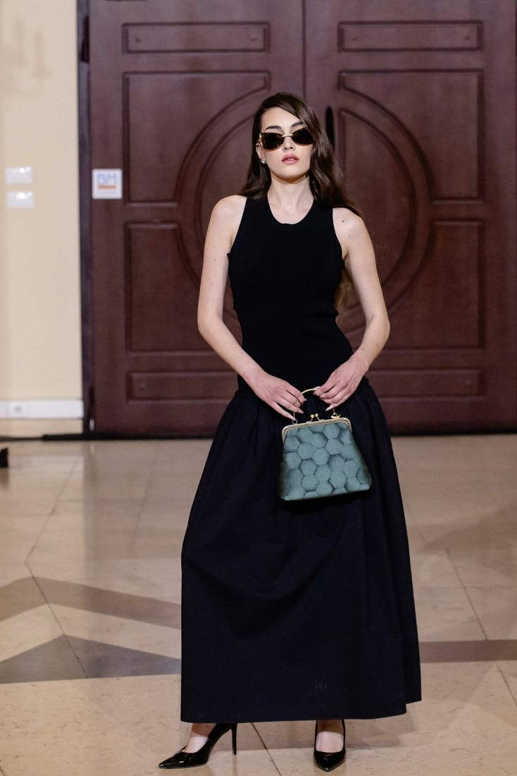 Look 28: Black drop-waist dress, green frame bag