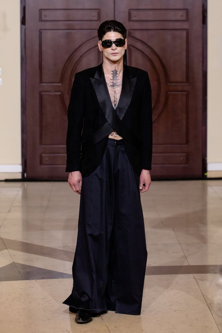 Look 29: Crossover tuxedo jacket, wide black trousers